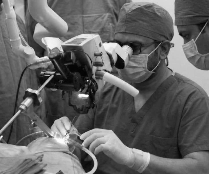 Dr. Santosh Kumar Gunapu at the operating microscope