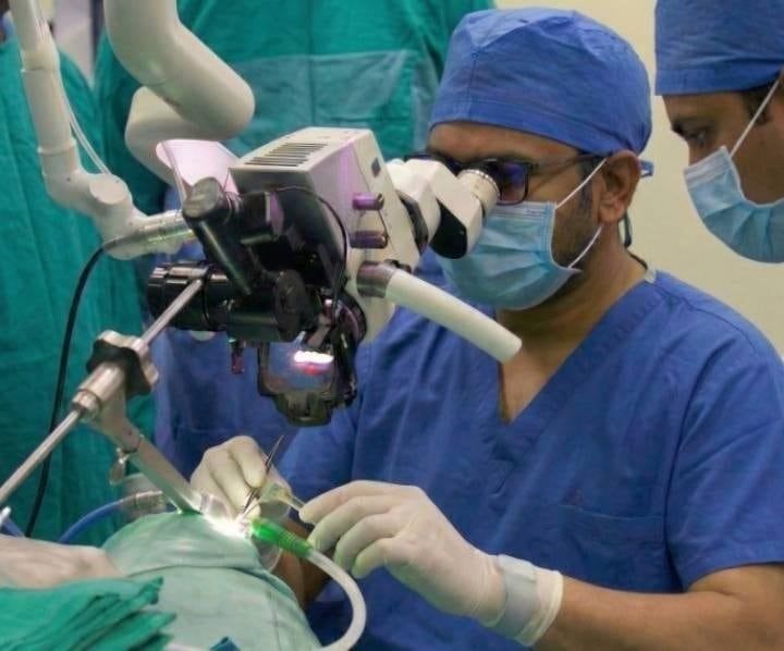 Reference: Dr. Santosh at the operating microscope
